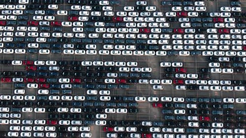 Motion Over Rows of Finished Cars at Open Warehouse Lot