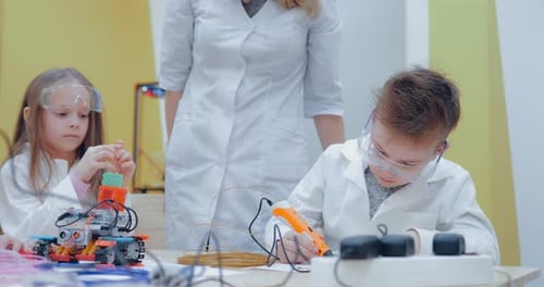 Schoolboy Drawing on Paper with 3D Pen