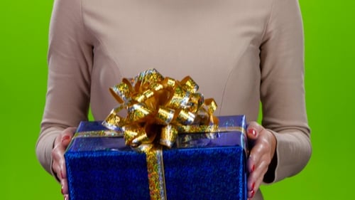 Woman holding a Shiny Blue Gift
