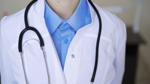 Friendly Doctor Smiling in Medical Setting