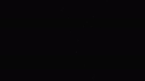 Sparkling Particles on a Dark Background with Subtle Motion