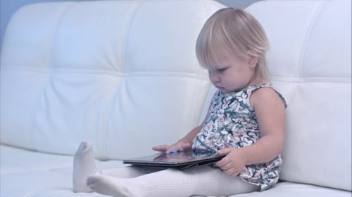 Baby Using Digital Tablet at Home