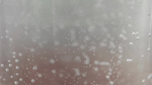 Bubbles Moving in Clear Translucent Liquid