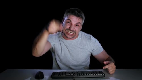 Guy in a Anger Shows Someone in a Computer Monitor