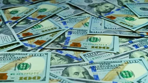 Pile of One Hundred US Dollar Bills