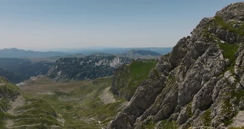 passing by a rocky mountain range with drone