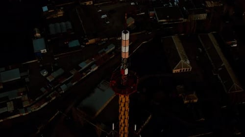 Top of Television Tower Built Above City with Buildings