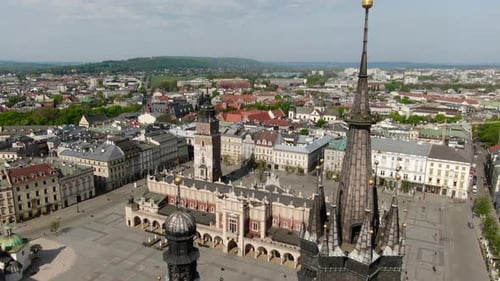 Flying over Main Square, Rynek Glowny in Krakow, Cracow city in Poland, Polska