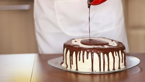 Decorating Delicious Frosted Cake with Chocolate Ganache
