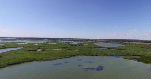 The Spill of a Small River in the Fields That Surround