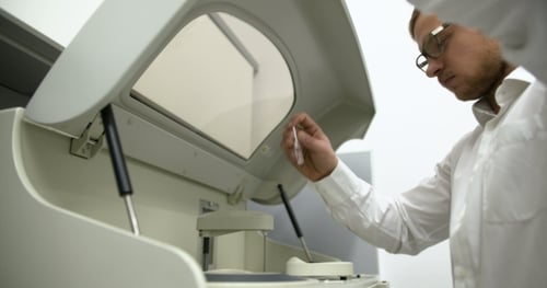Scientist Using Medical Equipment in Lab