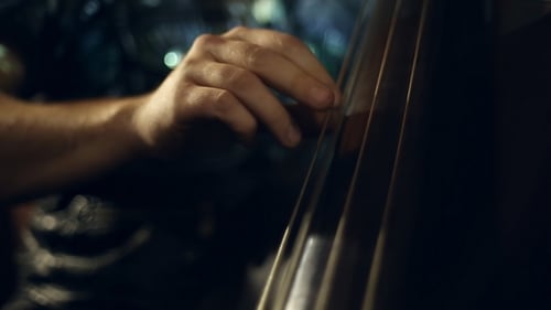Musician Playing Upright Bass in Dimly Lit Bar