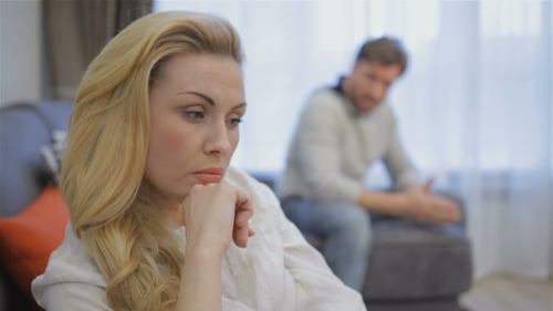 Couple Experiencing Conflict in a Living Room