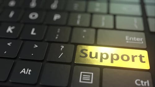Black Computer Keyboard and Gold Support Key