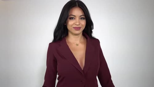 Stylish Woman Posing in a Maroon Blazer