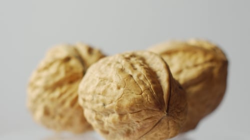 Rotating Walnuts Macro Shot on White Background