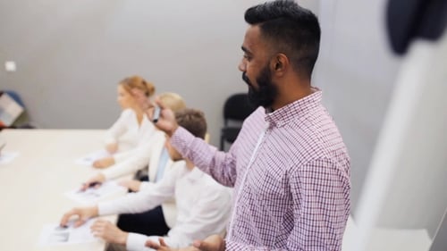 Business Team at Presentation in Office
