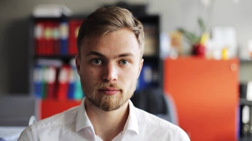 Smiling Young Man at Office