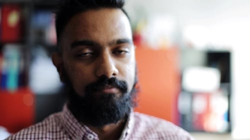 Happy Smiling Man with Beard at Office