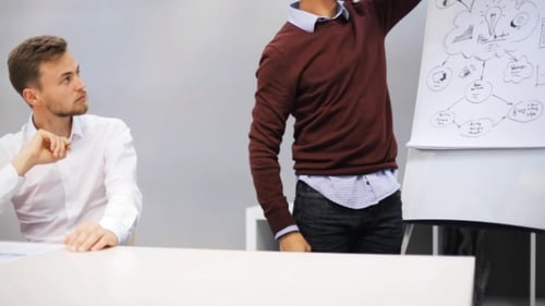 Business Team with Scheme at Presentation