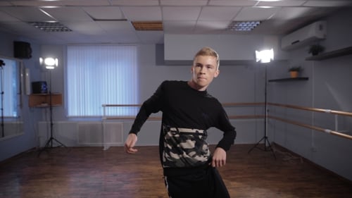 Stylish Man Dancing in Bright Dance Studio