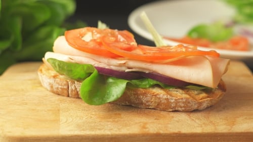 Making Healthy Sandwich on Wooden Cutting Board
