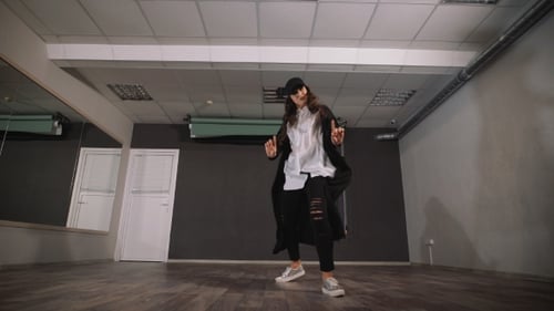 The Woman in Empty Studio Takes Dancing Lessons