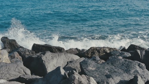 Ocean Waves Crashing on Stone Beach