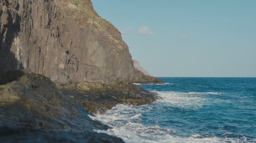 Ocean, Blue Water Waves Crashing on Volcanic Rocks