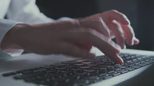 Fingers Typing on Laptop Keyboard Close Up