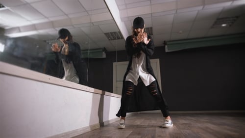 Young Girl Dancing in Studio. She Rehearses. Practiced Movement for the Feet, As She Soon Hip Hop