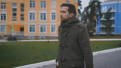 Unshaven Man, Tall Walking Along the Path