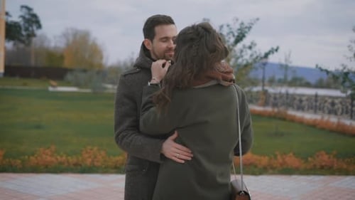 Affectionate Couple Embracing in Urban Park