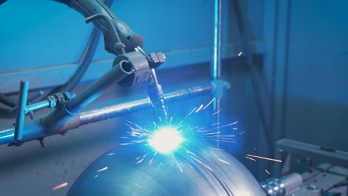 A Lot of Bright Sparks Scatter in Different Directions From the Workplace of Electric Welding