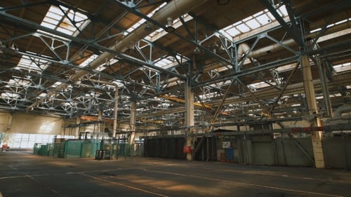 Spacious Interior of Industrial Factory Building with Skylights