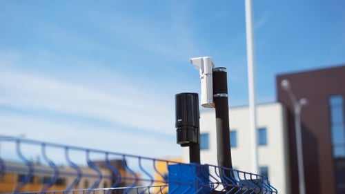 System of Video Surveillance and Motion Sensors Are Located on the Corner of the Fence. Modern