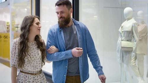 Video of couple strolling in shopping mall. Shot with RED helium camera in 8K.