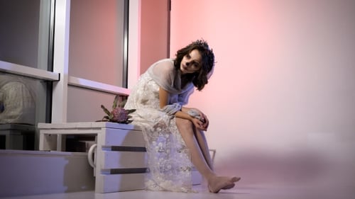 Woman with Theatrical Bridal Makeup Posing in Studio