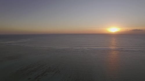 Aerial View of Yachts at Anchor and Ocean at Sunset