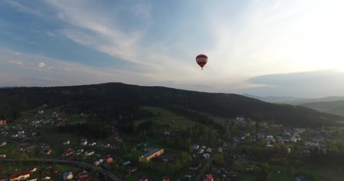 Balloon Flies Above a Small Town Closer To the Woods