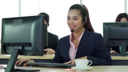 Business People Wearing Headset Working in Office