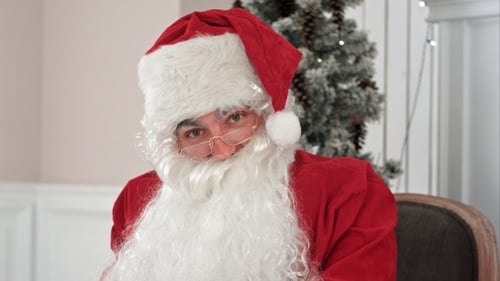 Man Dressed as Santa Claus Indoors