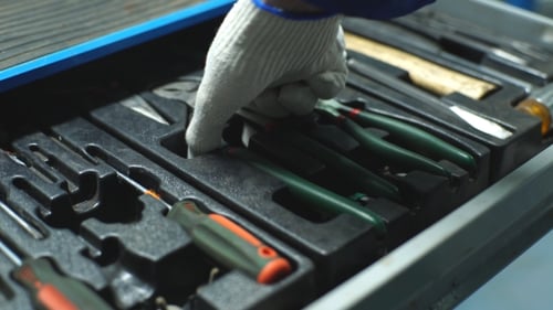 Auto Mechanic with Working Tools For Repair and Diagnostics of Cars in the Garage Car