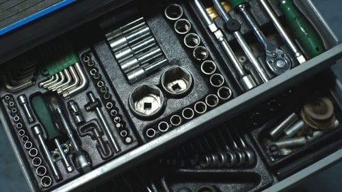 Auto Mechanic with Working Tools For Repair and Diagnostics of Cars in the Garage Car