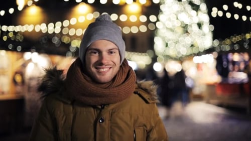 Man at Christmas Market Warms Hands