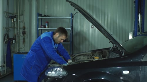 Portrait of a Mechanic at Work in His Garage