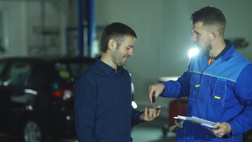 Auto Mechanic with Working Tools For Repair and Diagnostics of Cars in the Garage Car