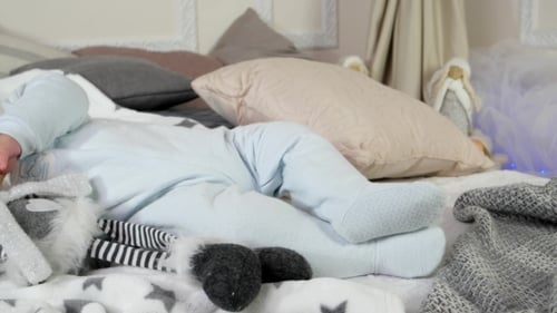Sleeping Child, Baby Sleeps on a Bed Among Pillows and Blankets, Little Boy Asleep in His Parents