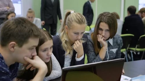 The Audience at the University. One of the Teams Are Actively Discussing the Job
