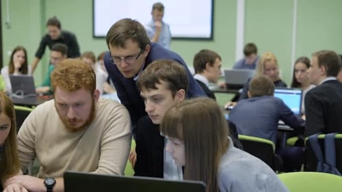 Students Learning Software With Instructor in Classroom